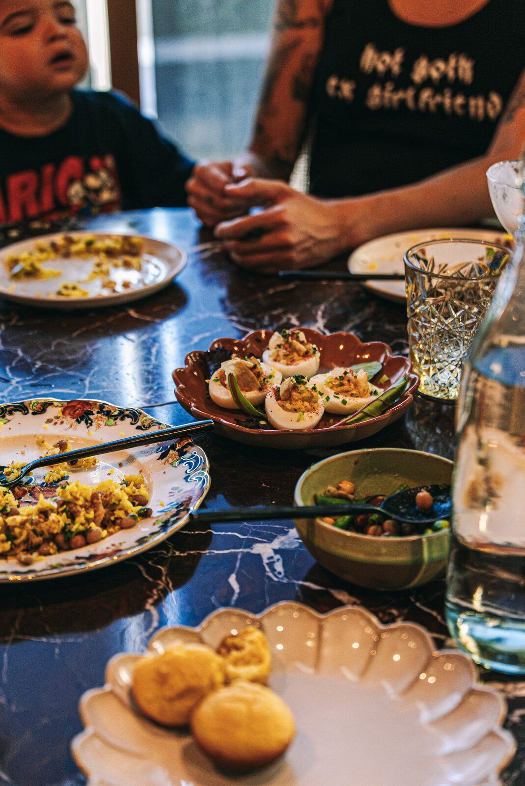 Table spread with deviled eggs, dirty rice, and hot skillet cornbread - Southern dining Walnut Creek
